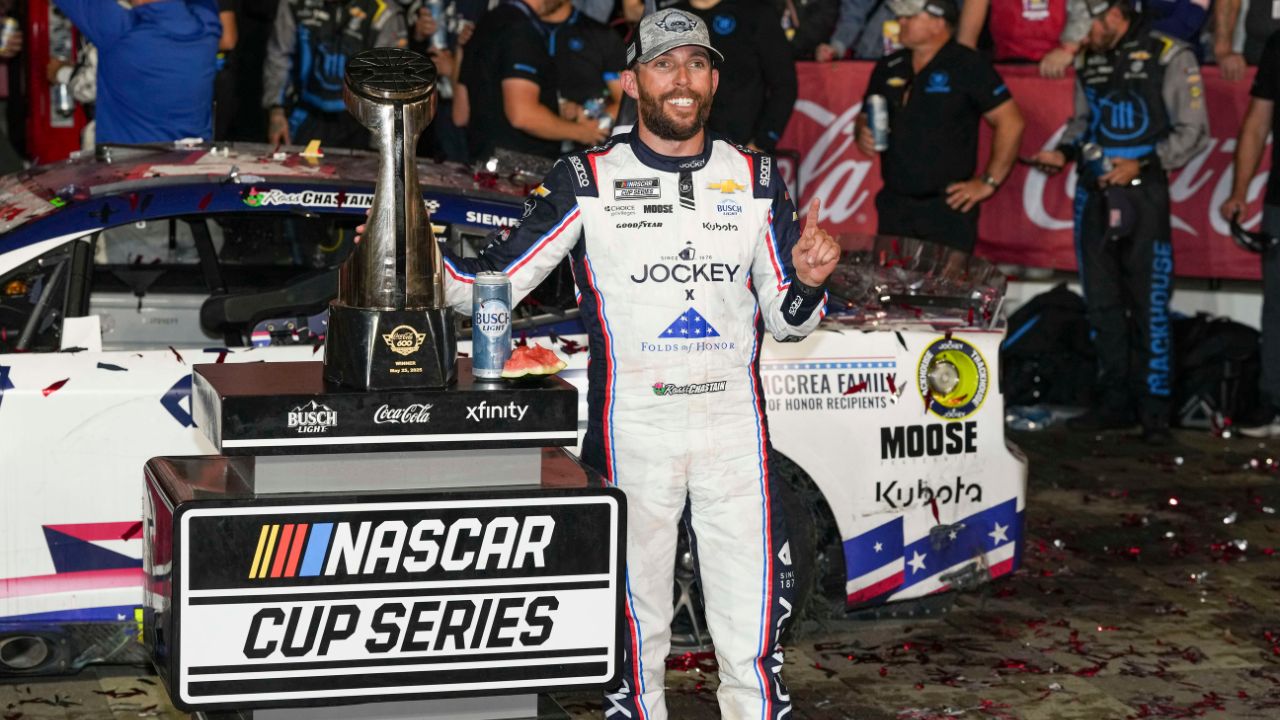 NASCAR Cup Series driver Ross Chastain (1) celebrates his win during the Coca Cola 600 at Charlotte Motor Speedway.
