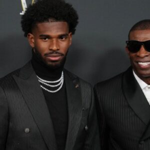 Deion Sanders (right) with his son Shedeur Sanders on the red carpet before Super Bowl LIX NFL Honors at Saenger Theatre.
