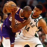Milwaukee Bucks forward Giannis Antetokounmpo (34) defends against Phoenix Suns forward Kevin Durant (35) at Footprint Center
