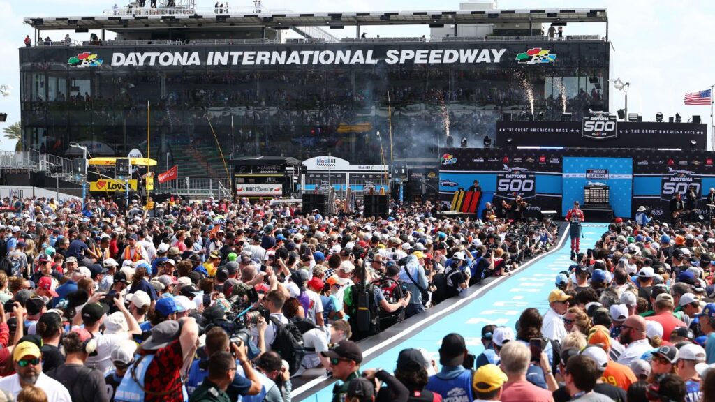 NASCAR Cup Series driver Helio Castroneves (91) greets fans during driver introductions before the Daytona 500 at Daytona International Speedway.
