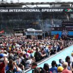 NASCAR Cup Series driver Helio Castroneves (91) greets fans during driver introductions before the Daytona 500 at Daytona International Speedway.