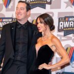 Kyle and Samantha Busch poses on the red carpet for the 2023 NASCAR Awards Banquet at the Music City Center in Nashville, Tenn.