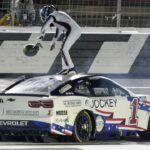 NASCAR Cup Series driver Ross Chastain (1) celebrates his come from behind win with a burnout and tossing a watermelon on the finish line during the Coca Cola 600 at Charlotte Motor Speedway.