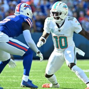 Miami Dolphins wide receiver Tyreek Hill (10) makes a move on Buffalo Bills cornerback Kaiir Elam (5) in a pass route in the first quarter at Highmark Stadium.