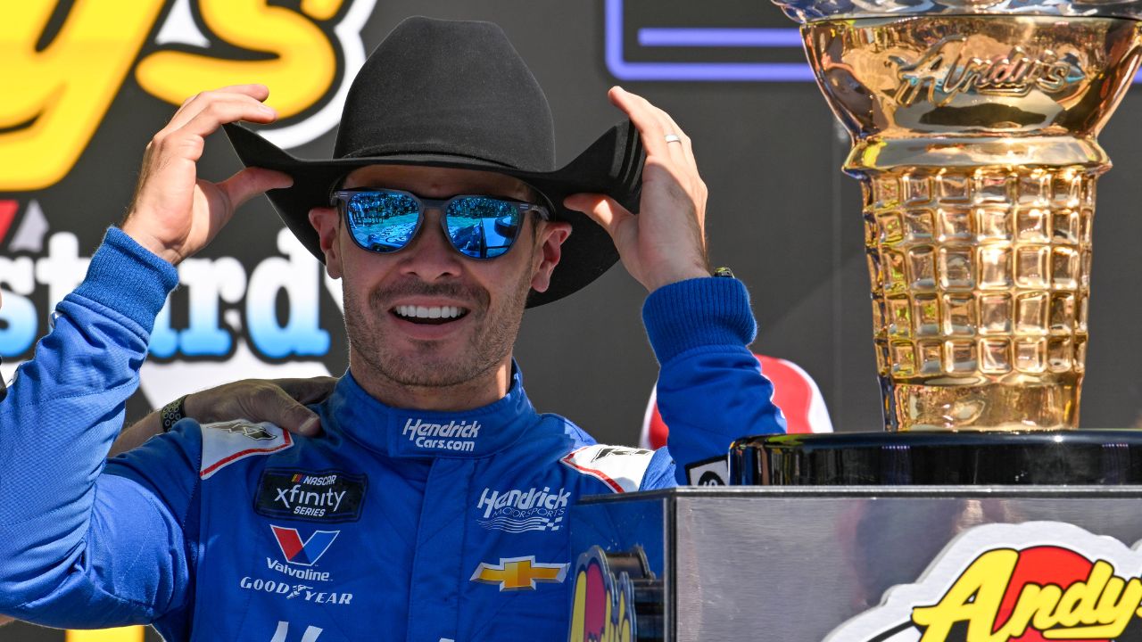 NASCAR Xfinity Series driver Kyle Larson (88) tries on a cowboy hat in Victory Lane after he wins the NASCAR Xfinity race at Texas Motor Speedway.