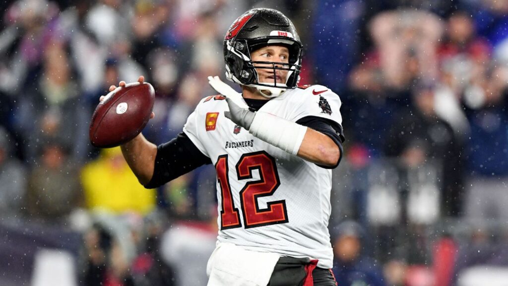 Tampa Bay Buccaneers quarterback Tom Brady (12) throws the ball against the New England Patriots during the first half at Gillette Stadium.