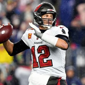 Tampa Bay Buccaneers quarterback Tom Brady (12) throws the ball against the New England Patriots during the first half at Gillette Stadium.