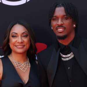 Washington Commanders quarterback Jayden Daniels and his mother Regina Jackson arrive on the red carpet before the 2024 ESPYS at Dolby Theatre.