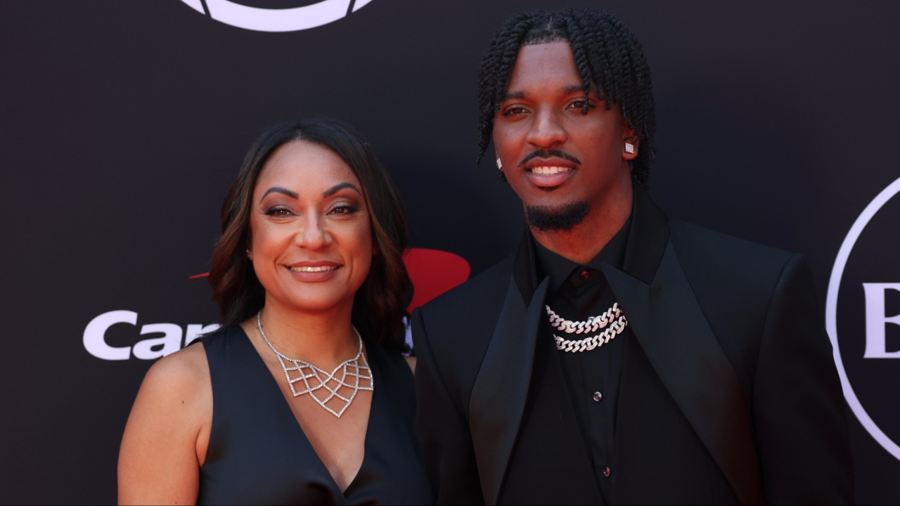 Washington Commanders quarterback Jayden Daniels and his mother Regina Jackson arrive on the red carpet before the 2024 ESPYS at Dolby Theatre.