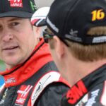 Former Sprint Cup Series driver Kurt Busch (41) talks with driver Greg Biffle (16) during qualifying for the Duck Commander 500 at Texas Motor Speedway.