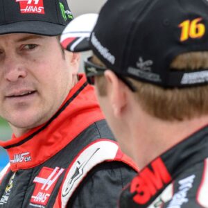 Former Sprint Cup Series driver Kurt Busch (41) talks with driver Greg Biffle (16) during qualifying for the Duck Commander 500 at Texas Motor Speedway.