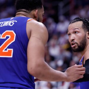 May 1, 2025; Detroit, Michigan, USA; New York Knicks guard Jalen Brunson (11) talks to center Karl-Anthony Towns (32) in the second half against the Detroit Pistons during game six of first round for the 2024 NBA Playoffs at Little Caesars Arena