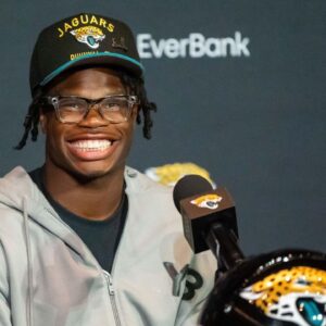 The Jacksonville Jaguars’ first-round pick, Colorado Buffaloes wide receiver and defensive back Travis Hunter, flashes his wide smile during a press conference Friday, March 25, 2025 at Miller Electric Center in Jacksonville, Fla.