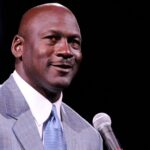 Dec 21, 2013; Charlotte, NC, USA; Charlotte Bobcats owner Michael Jordan unveils the new Charlotte Hornets logo at halftime during the game against the Utah Jazz at Time Warner Cable Arena.