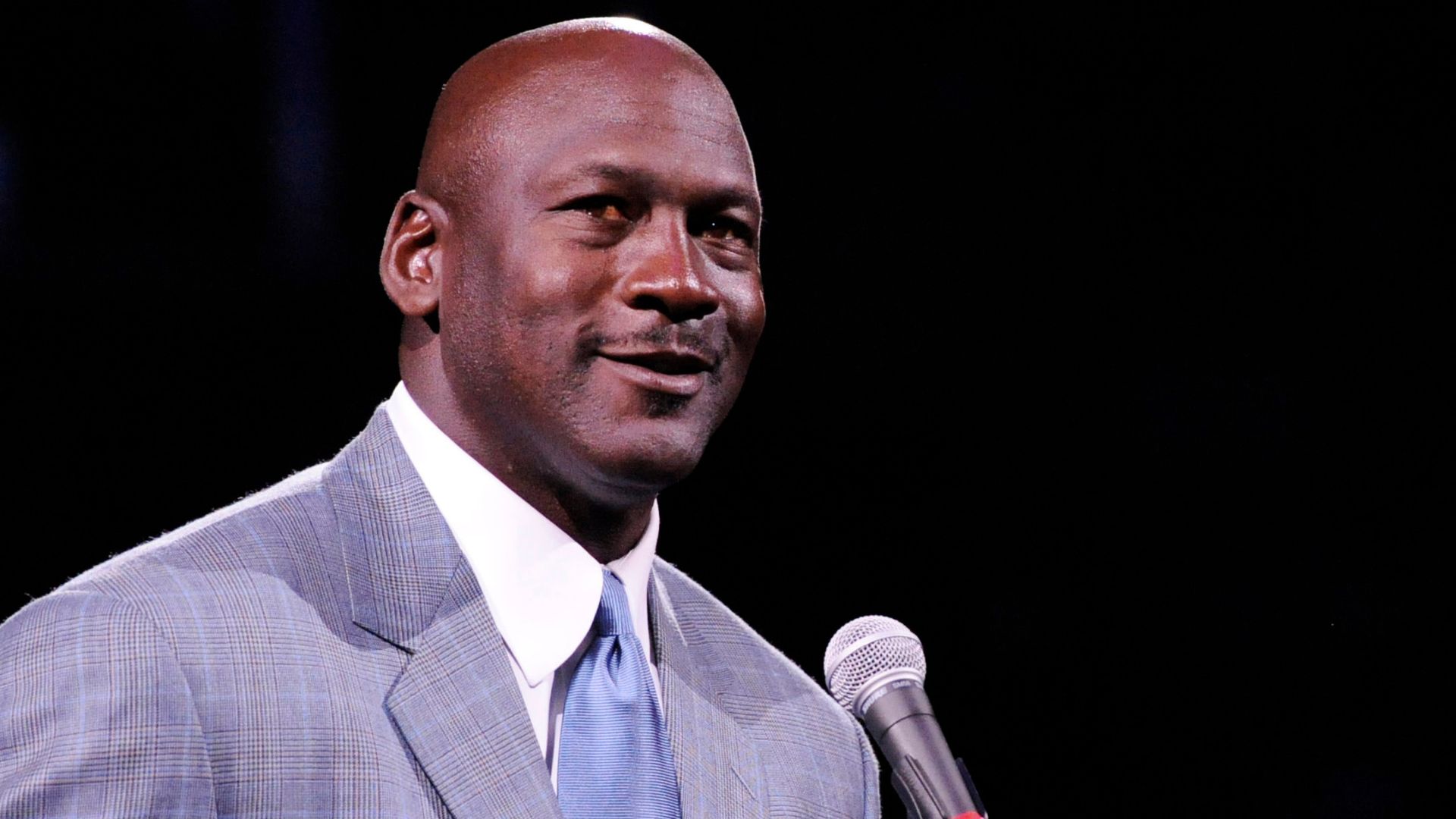 Dec 21, 2013; Charlotte, NC, USA; Charlotte Bobcats owner Michael Jordan unveils the new Charlotte Hornets logo at halftime during the game against the Utah Jazz at Time Warner Cable Arena.