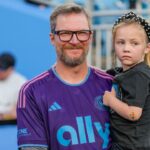Coronation guest Dale Earnhardt Jr. with his daughter Isla Rose during pregame warm ups between the Charlotte FC and the Colorado Rapids at Bank of America Stadium.