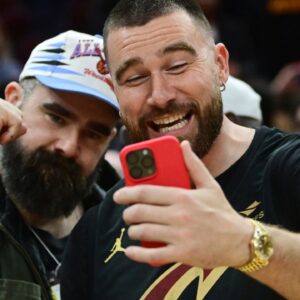 Mar 5, 2024; Cleveland, Ohio, USA; Cleveland natives and NFL players Travis, right, and Jason Kelce celebrate after the Cleveland Cavaliers beat the Boston Celtics during the second half at Rocket Mortgage FieldHouse.