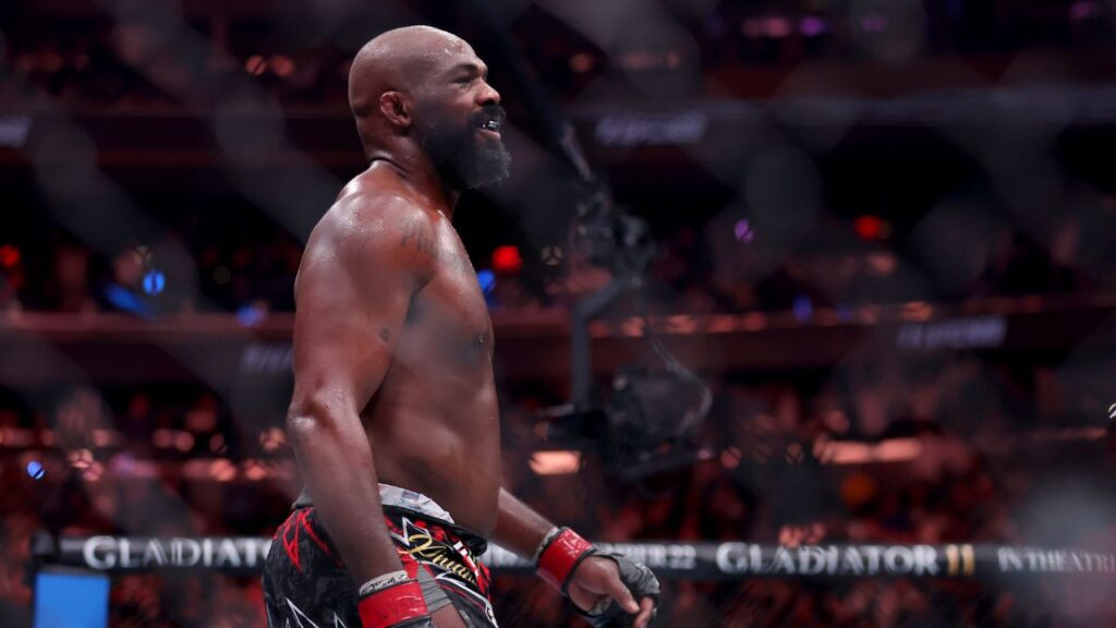 Jon Jones (red gloves) reacts after defeating Stipe Miocic (not pictured) in the heavyweight bout during UFC 309 at Madison Square Garden.