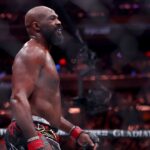 Jon Jones (red gloves) reacts after defeating Stipe Miocic (not pictured) in the heavyweight bout during UFC 309 at Madison Square Garden.