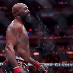 Jon Jones (red gloves) reacts after defeating Stipe Miocic (not pictured) in the heavyweight bout during UFC 309 at Madison Square Garden.