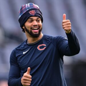 Chicago Bears quarterback Caleb Williams (18) warms up before the game against the Green Bay Packers at Soldier Field.
