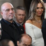US media personality Joe Rogan stands for a benediction after President Donald Trump was sworn in as the 47th US President in the US Capitol Rotunda in Washington
