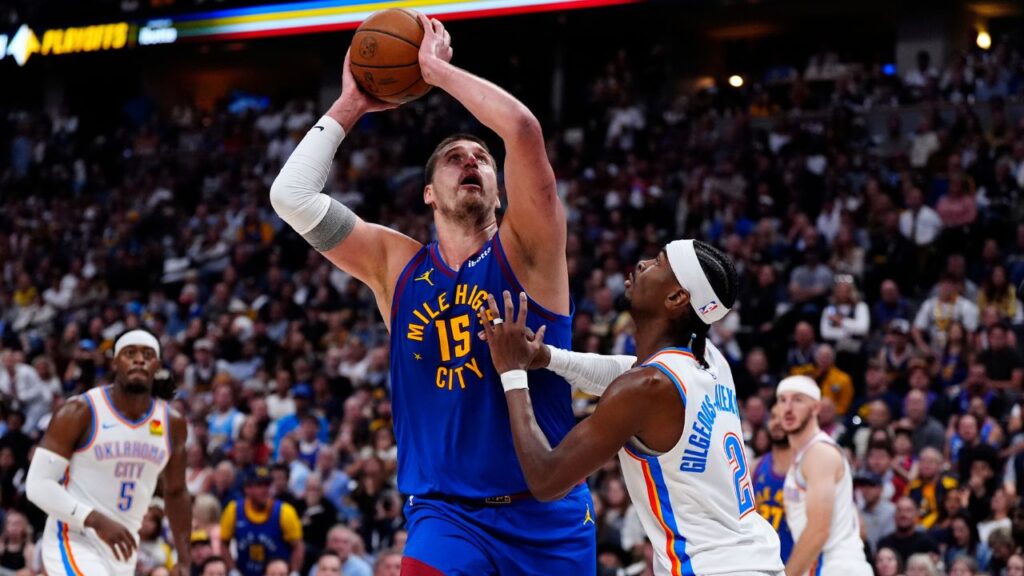 May 9, 2025; Denver, Colorado, USA; Oklahoma City Thunder guard Shai Gilgeous-Alexander (2) defends Denver Nuggets center Nikola Jokic (15) in the second half during game three of the second round for the 2025 NBA Playoffs at Ball Arena. Mandatory Credit: Ron Chenoy-Imagn Images