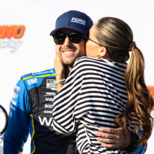 Ryan Blaney (12) gets a kiss from fiancé Gianna Tulio after winning the NASCAR Cup Series on July 14, 2024