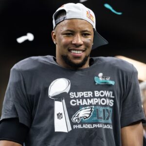 Philadelphia Eagles running back Saquon Barkley (26) celebrates after defeating the Kansas City Chiefs during Super Bowl LIX at Ceasars Superdome.