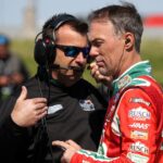 Kevin Harvick (right) talks with his crew chief Rodney Childers (left) during practice for the DuraMAX Drydene 400 at Dover Motor Speedway.