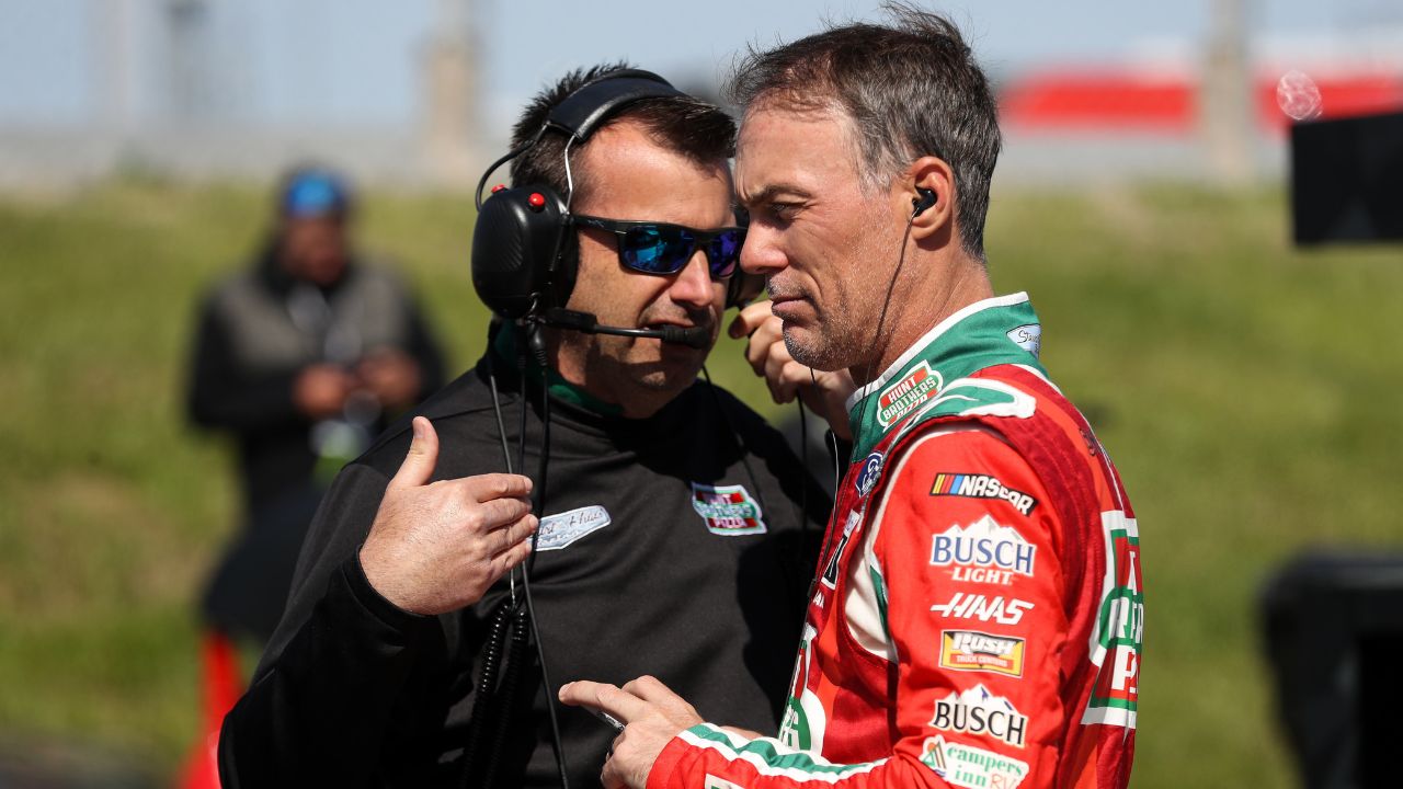 Kevin Harvick (right) talks with his crew chief Rodney Childers (left) during practice for the DuraMAX Drydene 400 at Dover Motor Speedway.