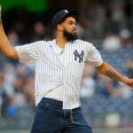 Minnesota Timberwolves Karl-Anthony Towns throws out the first pitch prior to the game between the Baltimore Orioles and New York Yankees at Yankee Stadium.