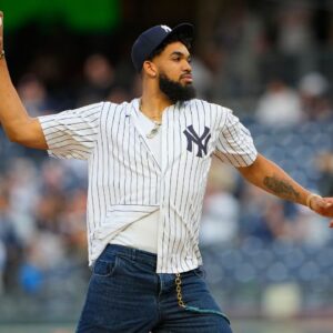 Minnesota Timberwolves Karl-Anthony Towns throws out the first pitch prior to the game between the Baltimore Orioles and New York Yankees at Yankee Stadium.