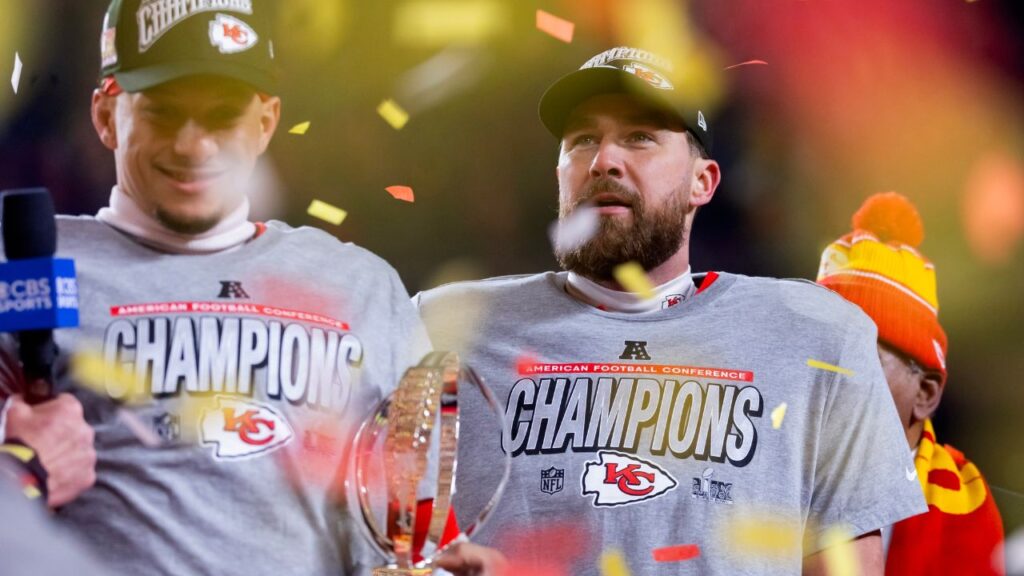 Kansas City Chiefs tight end Travis Kelce (right) celebrates with quarterback Patrick Mahomes after defeating the Buffalo Bills during the AFC Championship game at GEHA Field at Arrowhead Stadium.