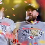 Kansas City Chiefs tight end Travis Kelce (right) celebrates with quarterback Patrick Mahomes after defeating the Buffalo Bills during the AFC Championship game at GEHA Field at Arrowhead Stadium.