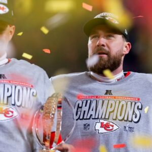 Kansas City Chiefs tight end Travis Kelce (right) celebrates with quarterback Patrick Mahomes after defeating the Buffalo Bills during the AFC Championship game at GEHA Field at Arrowhead Stadium.
