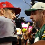 Tampa Bay Buccaneers quarterback Tom Brady (12) and Green Bay Packers quarterback Aaron Rodgers (12) greet after the game at Raymond James Stadium.