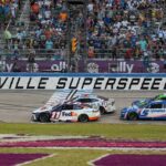 NASCAR Cup Series driver Ross Chastain (1), Denny Hamlin (11), Kyle Busch (8), and Kyle Larson (5) come to the line after a restart during the Ally 400 at Nashville Superspeedway.