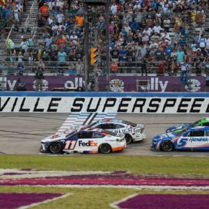 NASCAR Cup Series driver Ross Chastain (1), Denny Hamlin (11), Kyle Busch (8), and Kyle Larson (5) come to the line after a restart during the Ally 400 at Nashville Superspeedway.
