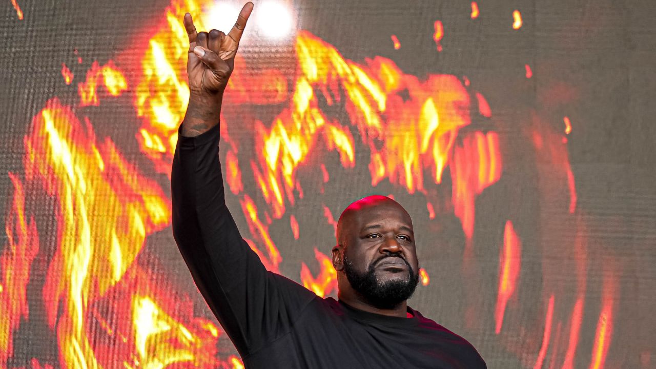 Shaquille O'Neal holds up the sign of the horns during a DJ performance ahead of the College Football Playoff semifinal game between the Texas Longhorns and Ohio State in the Cotton Bowl at AT&T Stadium on Friday, Jan. 10, 2024 in Arlington, Texas.