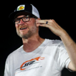 Jul 20, 2024; Hampton, VA, USA; Dale Earnhardt Jr. talks with late model drive Ryley Music before qualifying for the 16th Annual Hampton Heat at Langley Speedway. Mandatory Credit: Peter Casey-Imagn Images