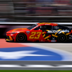 May 4, 2025; Fort Worth, Texas, USA; NASCAR Cup Series driver Bubba Wallace (23) drives during the Wurth 400 race at Texas Motor Speedway. Mandatory Credit: Jerome Miron-Imagn Images