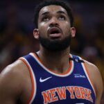 May 27, 2025; Indianapolis, Indiana, USA; New York Knicks center Karl-Anthony Towns (32) looks up at a scoreboard during the third quarter against the Indiana Pacers of game four of the eastern conference finals for the 2025 NBA Playoffs at Gainbridge Fieldhouse