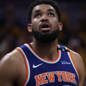 May 27, 2025; Indianapolis, Indiana, USA; New York Knicks center Karl-Anthony Towns (32) looks up at a scoreboard during the third quarter against the Indiana Pacers of game four of the eastern conference finals for the 2025 NBA Playoffs at Gainbridge Fieldhouse