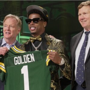 Wide receiver Matthew Golden of Texas poses with NFL Commissioner Roger Goodell and Green Bay Packers President and CEO Mark Murphy after being selected by the Green Bay Packers during the first round of the 2025 NFL Draft at Lambeau Field on April 24, 2025, in Green Bay.