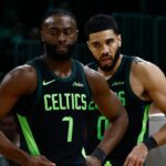 Boston Celtics guard Jaylen Brown (7) and forward Jayson Tatum (0) stand on the court during a timeout during the second half of their loss to the Cleveland Cavaliers at TD Garden.