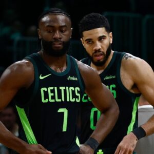 Boston Celtics guard Jaylen Brown (7) and forward Jayson Tatum (0) stand on the court during a timeout during the second half of their loss to the Cleveland Cavaliers at TD Garden.