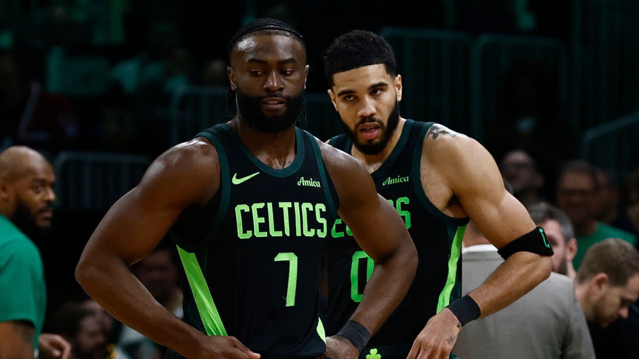 Boston Celtics guard Jaylen Brown (7) and forward Jayson Tatum (0) stand on the court during a timeout during the second half of their loss to the Cleveland Cavaliers at TD Garden.
