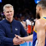 Golden State Warriors head coach Steve Kerr celebrates with guard Stephen Curry (30) after their team defeated the Oklahoma City Thunder at Paycom Center.