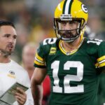 Green Bay Packers head coach Matt LaFleur talks with quarterback Aaron Rodgers (12) in between quarters against the Chicago Bears during their game on Sep 18, 2022, in Green Bay, Wisconsin.